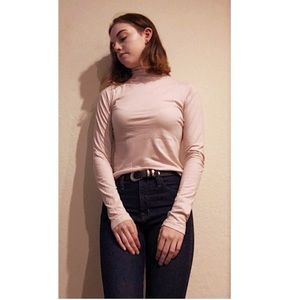 Light pink, mock neck long-sleeve.